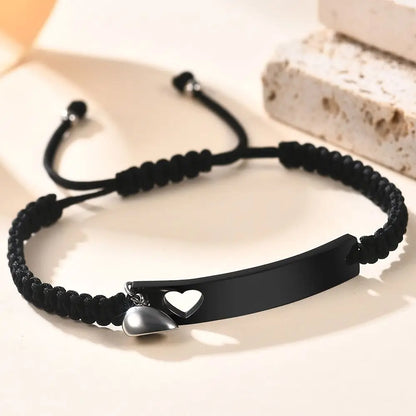 Personalisietes Edelstahl-Paararmband als Set, schwarz gewebt mit Herz-Magnetverschluss