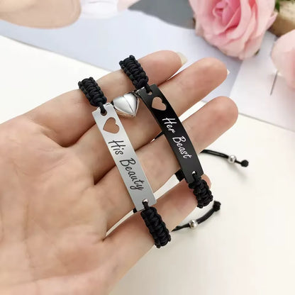 Personalisietes Edelstahl-Paararmband als Set, schwarz gewebt mit Herz-Magnetverschluss